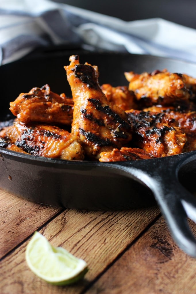 Grilled Sriracha hot wings with ginger, honey, soy sauce, lemongrass, lime juice, brown sugar and Sriracha.