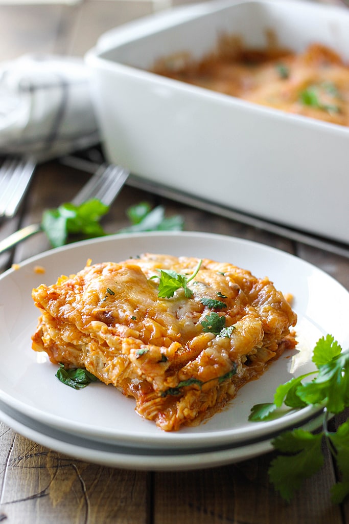 Enjoy the taste of enchiladas at home with tons of cheese! Here's a chicken enchilada casserole that's super easy to make and customize.