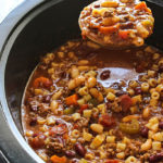 Break out the bowls for some comfort. This slow cooker beef and beans pasta soup has everything you need. Don't forget the Parmesan.