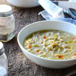 A slow cooker white chicken chili with tender chicken and beans simmered in a thick broth with green chilies, onions and celery. Pair it with your favorite toppings.