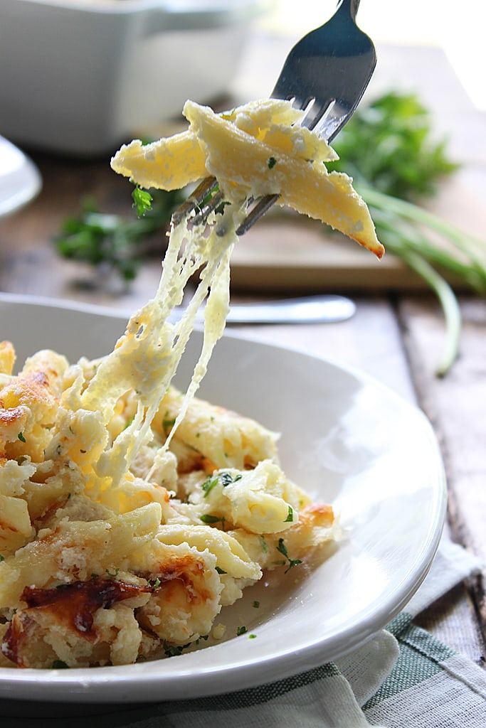 Creamy, cheesy packed chicken Alfredo pasta bake with three kinds of cheese and plenty to go around. Lots of gooey, stringy cheese in this fall casserole!